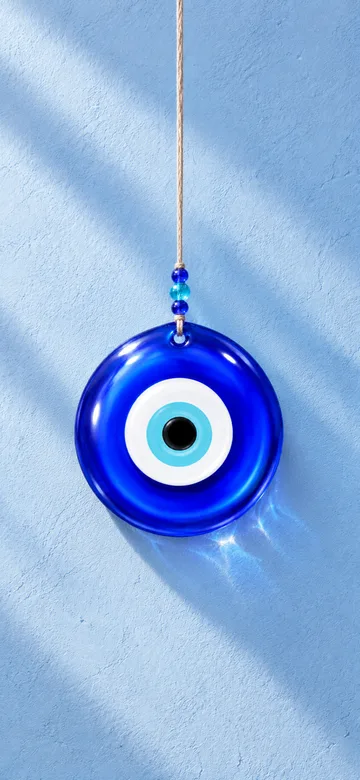 Nazar charm on a daylight wall